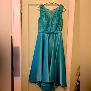 Two aqua bridesmaid dresses from JJ’s house